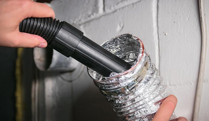 Dryer vent cleaning using vacuum