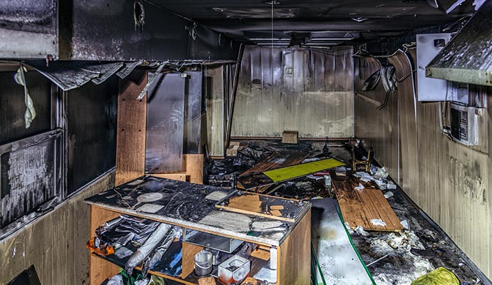A severely fire-damaged kitchen