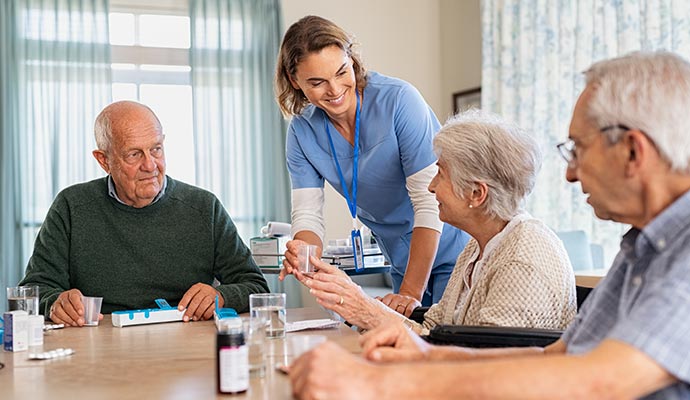 Assisted living center with a staff member and residents