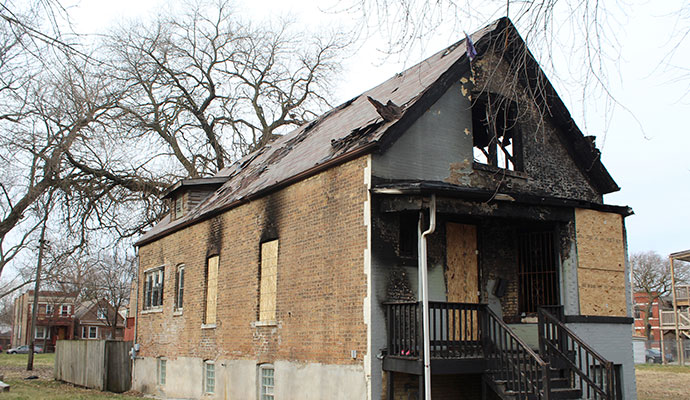 Boarded-up burnt home