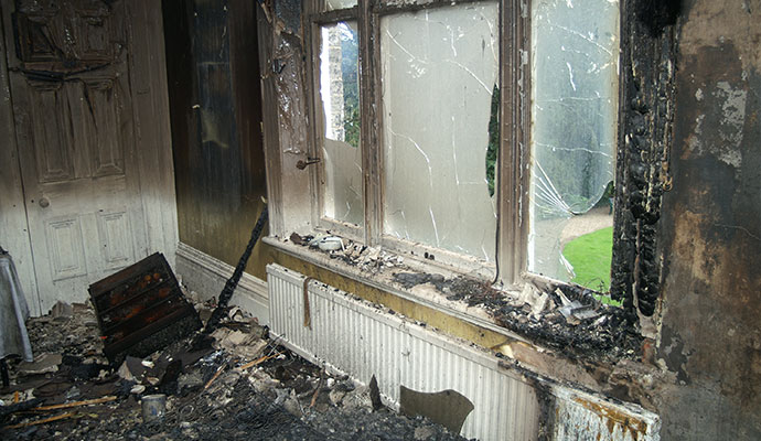 Structural fire damaged window and wall