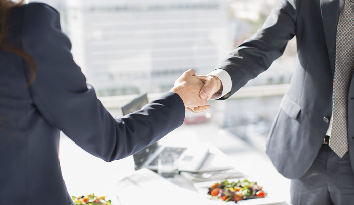 Professional handshake for insurance claims