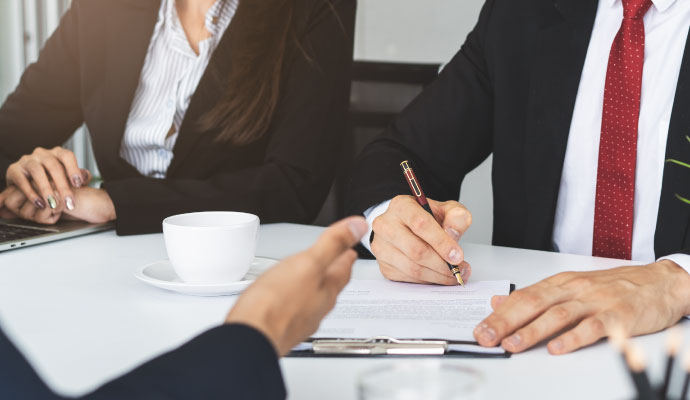 Professional signing insurance claims document