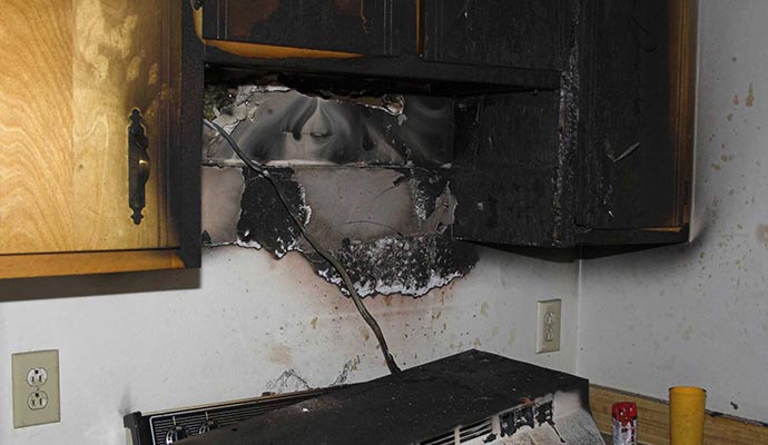 Fire damaged oven in kitchen Fire damaged oven in kitchen