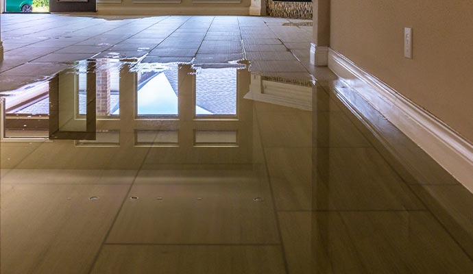 Flooded tile floor in a room