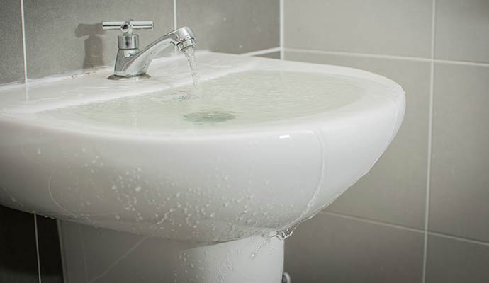 Water overflowing from bathroom sink